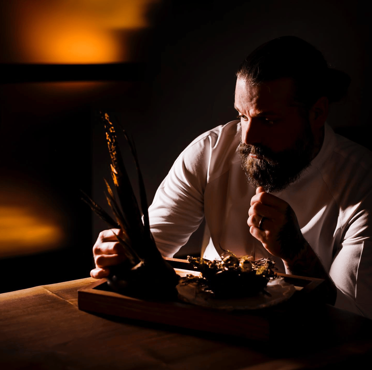 Chef preparing a dish at Nordhavn Rustik